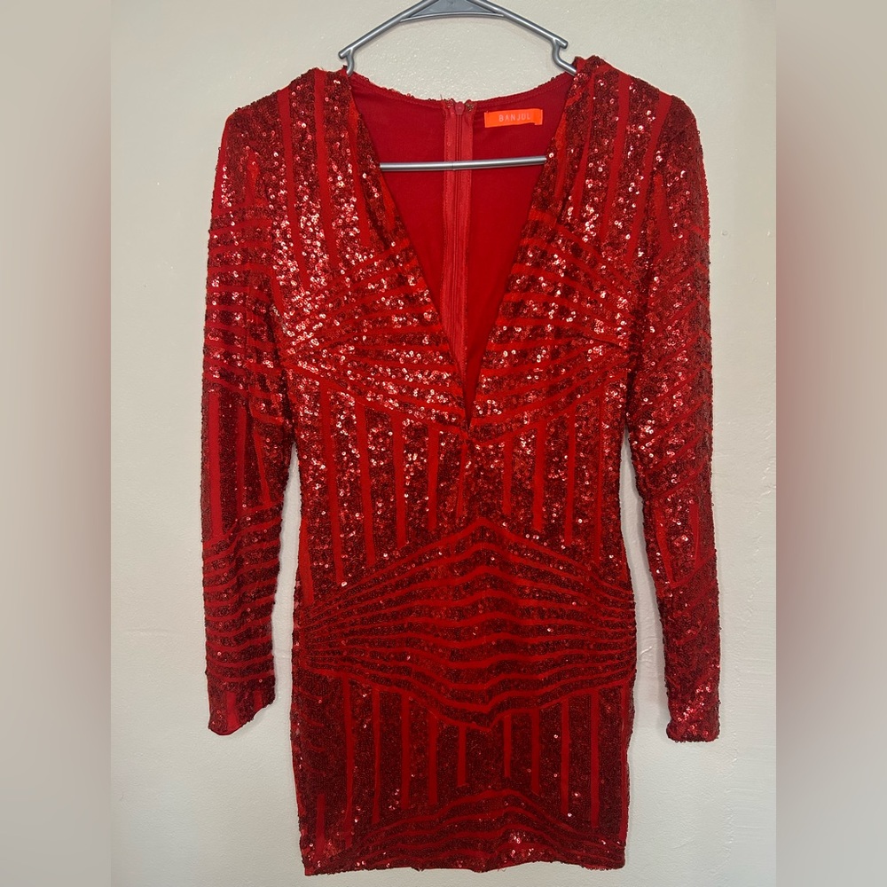 Beautiful red suit with glitter and front neckline.